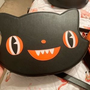 Em and sprout crossbody cat bag